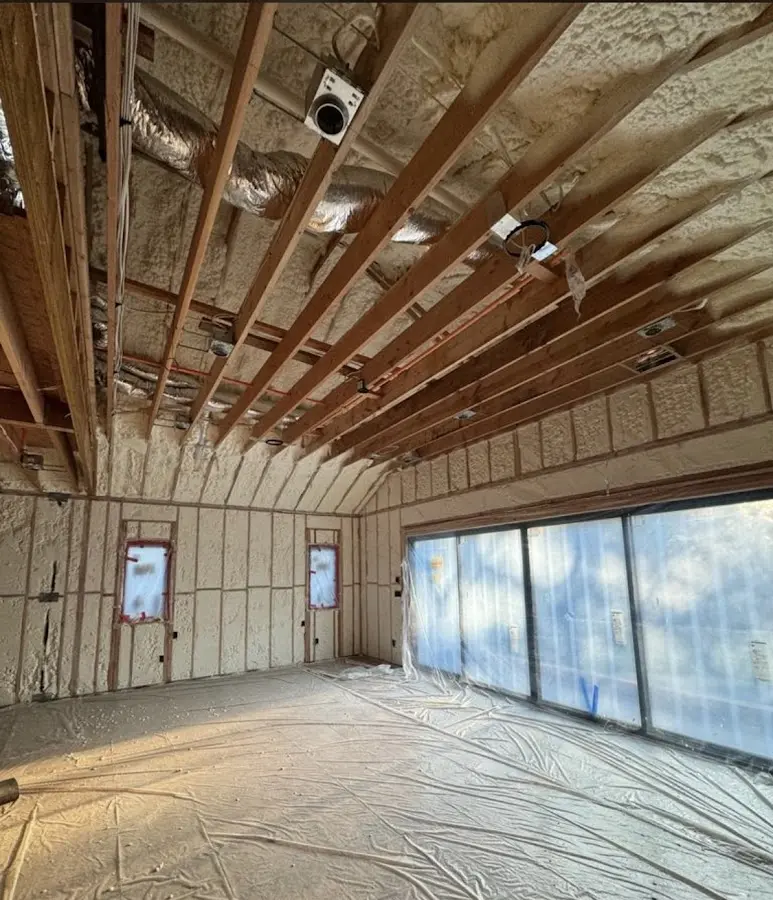 Interior walls and ceiling insulated with spray foam during new construction in Clay